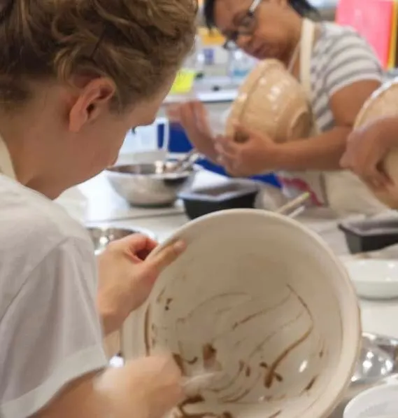 People in a Greenwich Pantry cooking class.