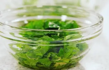 Glass bowl with a green salad