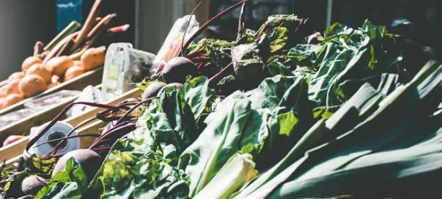 Image of seasonal vegetables; leeks, cabbages, potatoes and beetroot.